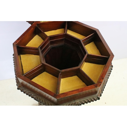 572 - Mahogany sewing box having an octagonal top opening to reveal a compartmentalised interior raised on... 