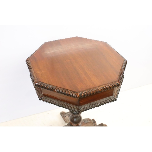 572 - Mahogany sewing box having an octagonal top opening to reveal a compartmentalised interior raised on... 