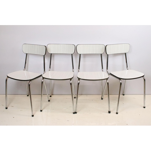 573 - Vintage 1970s Tavo formica topped dining table and chairs having a chrome tubular legs in a white an... 