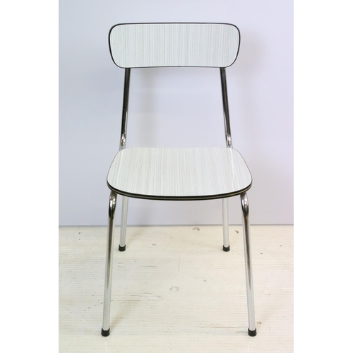 573 - Vintage 1970s Tavo formica topped dining table and chairs having a chrome tubular legs in a white an... 