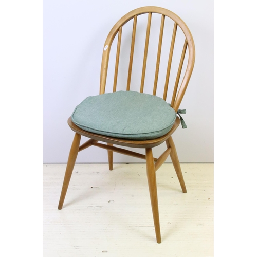 581 - Group of four vintage mid 20th Century light Ercol hoop back dining chairs, raised on turned legs un... 