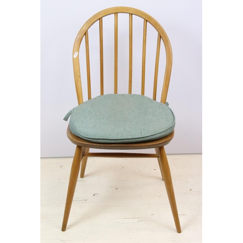 581 - Group of four vintage mid 20th Century light Ercol hoop back dining chairs, raised on turned legs un... 