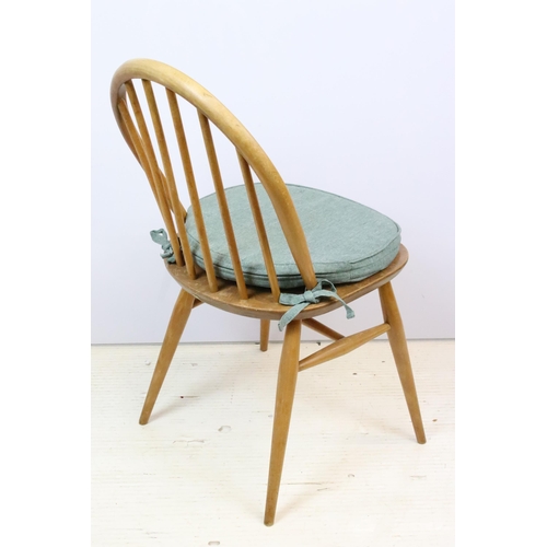 581 - Group of four vintage mid 20th Century light Ercol hoop back dining chairs, raised on turned legs un... 