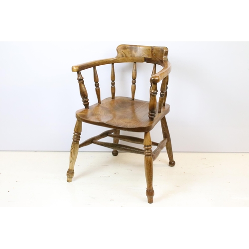 585 - Early 20th Century elm captains elbow chair having turned supports with H stretcher to base, raised ... 