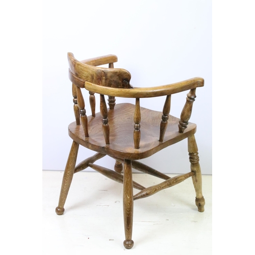 585 - Early 20th Century elm captains elbow chair having turned supports with H stretcher to base, raised ... 