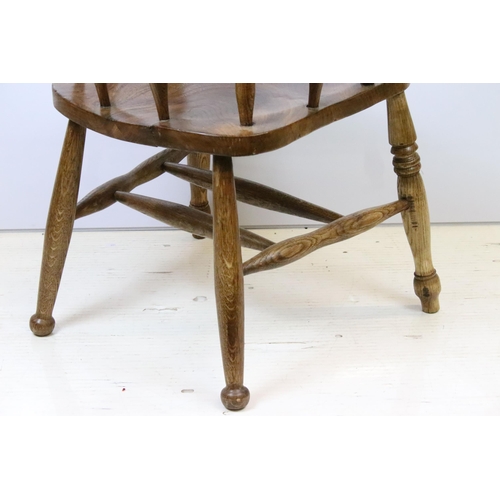 585 - Early 20th Century elm captains elbow chair having turned supports with H stretcher to base, raised ... 