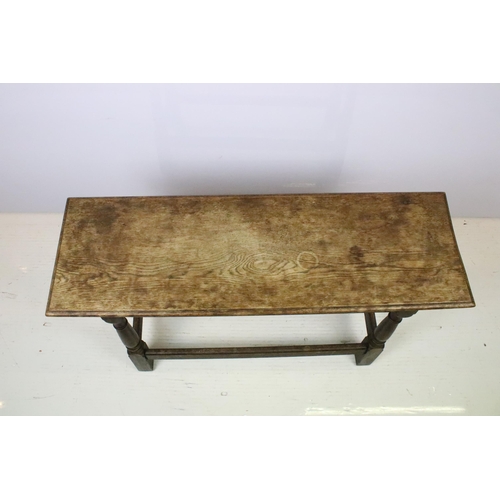 586 - Early 20th century rectangular oak bench on turned supports with stretchered base, 53.5cm high x 91c... 