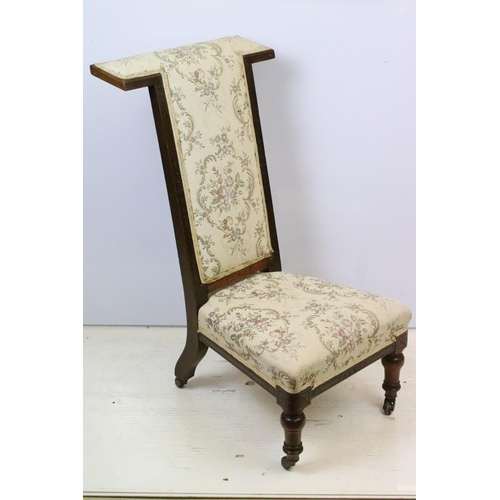 587 - 19th Century Victorian nursing chair having a mahogany frame with over stuffed seat, raised on ceram... 