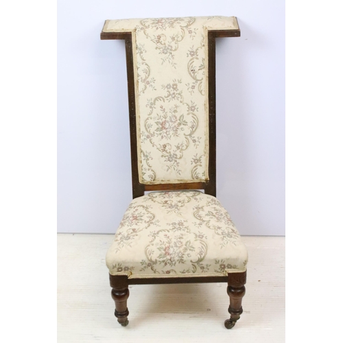 587 - 19th Century Victorian nursing chair having a mahogany frame with over stuffed seat, raised on ceram... 