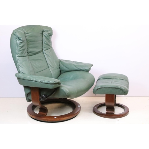 589 - Ekornes Stressless green leather arm chair with matching footstool. Measures 100 x 84 x 70cm.