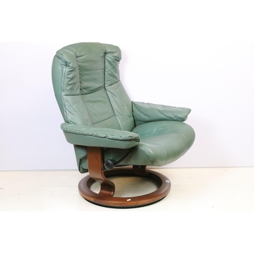 589 - Ekornes Stressless green leather arm chair with matching footstool. Measures 100 x 84 x 70cm.