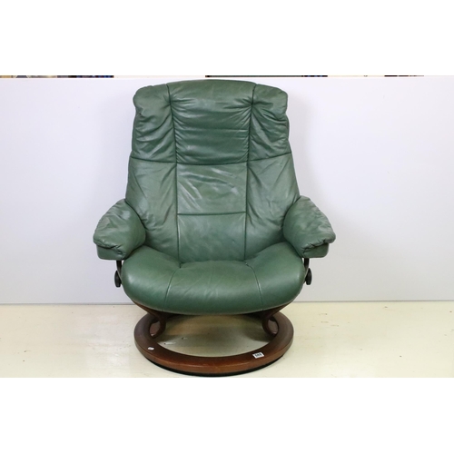 589 - Ekornes Stressless green leather arm chair with matching footstool. Measures 100 x 84 x 70cm.