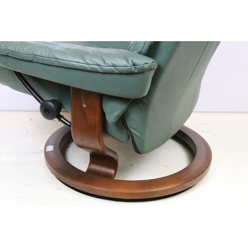 589 - Ekornes Stressless green leather arm chair with matching footstool. Measures 100 x 84 x 70cm.