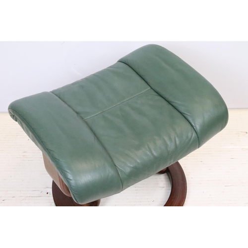 589 - Ekornes Stressless green leather arm chair with matching footstool. Measures 100 x 84 x 70cm.