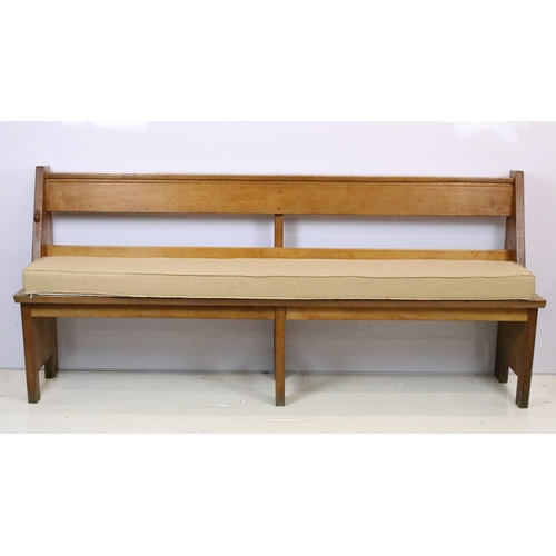 590 - Robert 'Mouseman' Thompson, oak bench / church pew, with pocket for hymn books and padded seat cushi... 