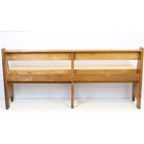 590 - Robert 'Mouseman' Thompson, oak bench / church pew, with pocket for hymn books and padded seat cushi... 