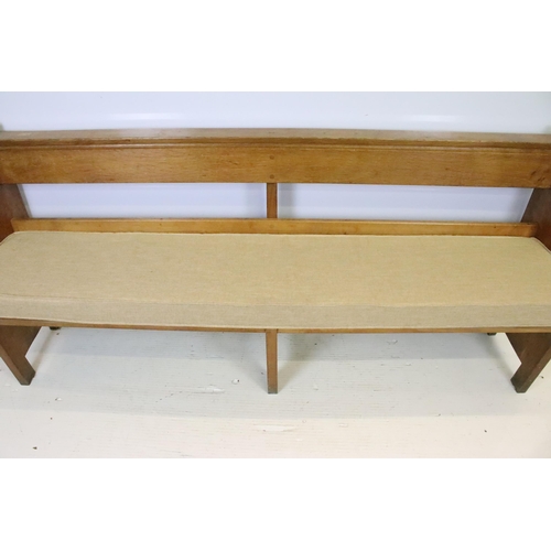 590 - Robert 'Mouseman' Thompson, oak bench / church pew, with pocket for hymn books and padded seat cushi... 