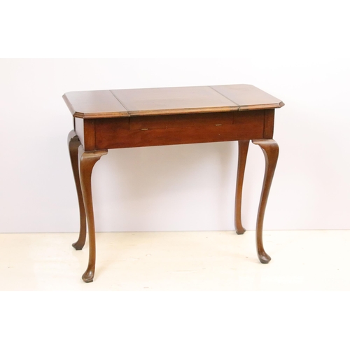 593 - Early 20th century metamorphic Britisher mahogany writing table, with maker's plaque - '