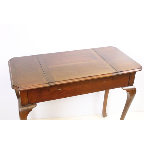 593 - Early 20th century metamorphic Britisher mahogany writing table, with maker's plaque - '