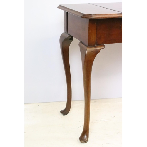 593 - Early 20th century metamorphic Britisher mahogany writing table, with maker's plaque - '