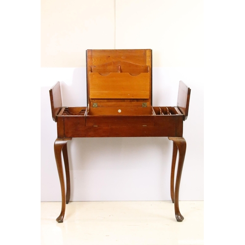 593 - Early 20th century metamorphic Britisher mahogany writing table, with maker's plaque - '