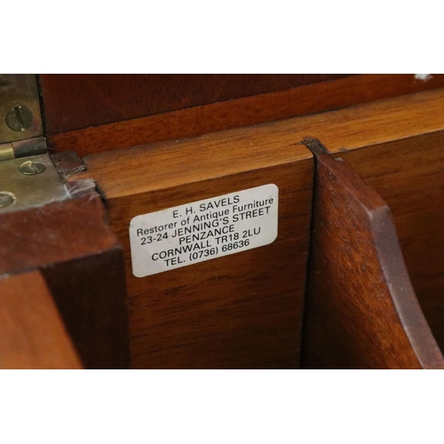 593 - Early 20th century metamorphic Britisher mahogany writing table, with maker's plaque - '