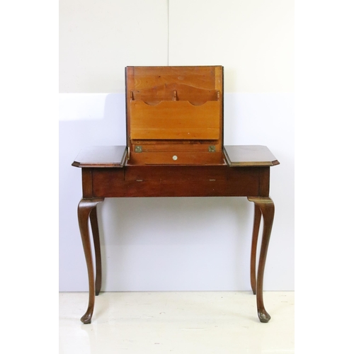 593 - Early 20th century metamorphic Britisher mahogany writing table, with maker's plaque - '