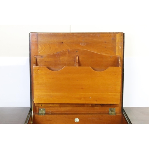 593 - Early 20th century metamorphic Britisher mahogany writing table, with maker's plaque - '