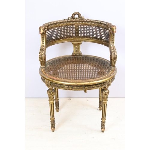 594 - Louis XV1 gilt wood vanity chair with cane, cane back rest with wreath and ram scroll carved detail ... 