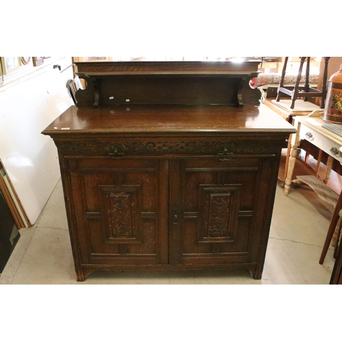 598 - 20th century oak sideboard, with galleried shelf back, above carved frieze drawer and a pair of carv... 