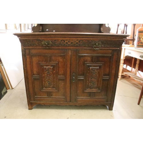 598 - 20th century oak sideboard, with galleried shelf back, above carved frieze drawer and a pair of carv... 