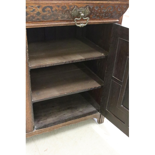 598 - 20th century oak sideboard, with galleried shelf back, above carved frieze drawer and a pair of carv... 