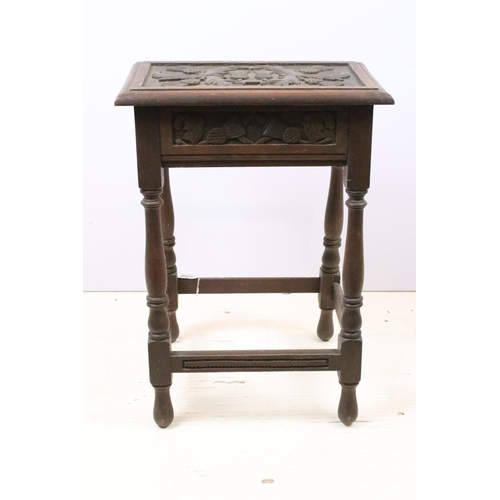 602 - Early 20th century oak stool, the top carved with thistles on turned legs and stretchered base, 61cm... 