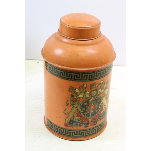 604 - Pair of early 20th century tole peint tea canisters, each decorated with coat of arms, 45cm high