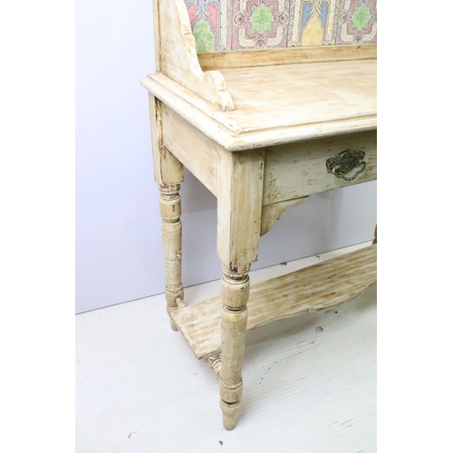 605 - Early 20th century painted wash stand with tiled galleried splashback, with faux drawer above shaped... 