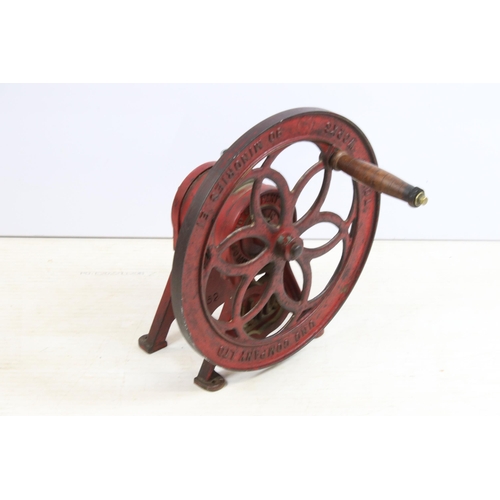 444 - Mid 20th century Uno cast iron coffee grinder on footed base with turning wheel and wooden handle, '... 