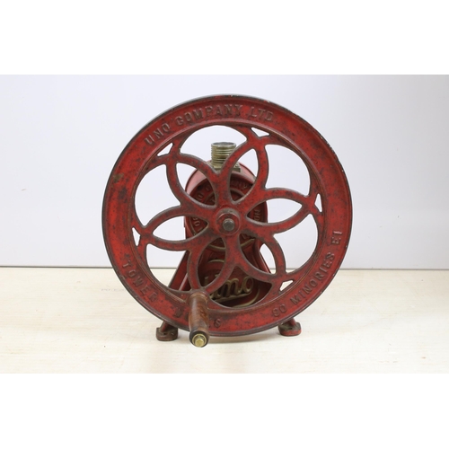 444 - Mid 20th century Uno cast iron coffee grinder on footed base with turning wheel and wooden handle, '... 