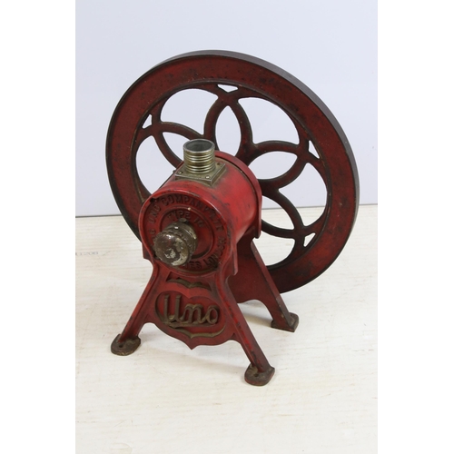 444 - Mid 20th century Uno cast iron coffee grinder on footed base with turning wheel and wooden handle, '... 