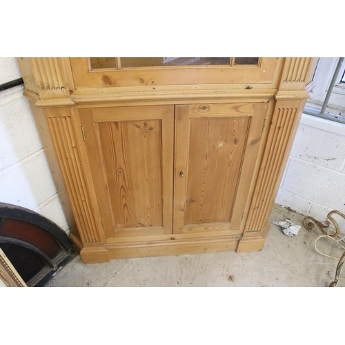 559 - 20th century pine corner cupboard, with breakfront pediment, astragal glazed door opening to reveal ... 