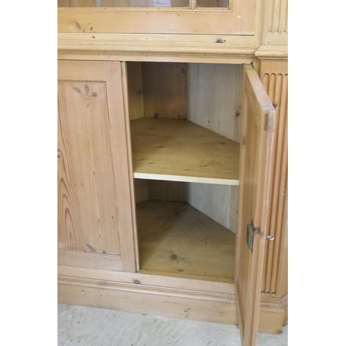 559 - 20th century pine corner cupboard, with breakfront pediment, astragal glazed door opening to reveal ... 