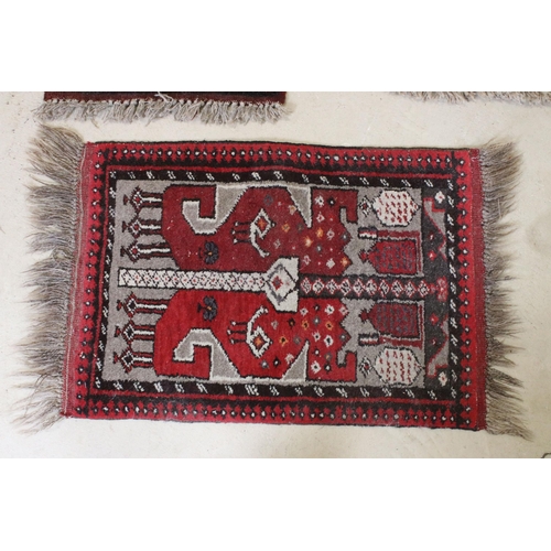 595 - Red ground prayer mat with geometric design, 74 x 60.5cm and two other prayer mats (3)