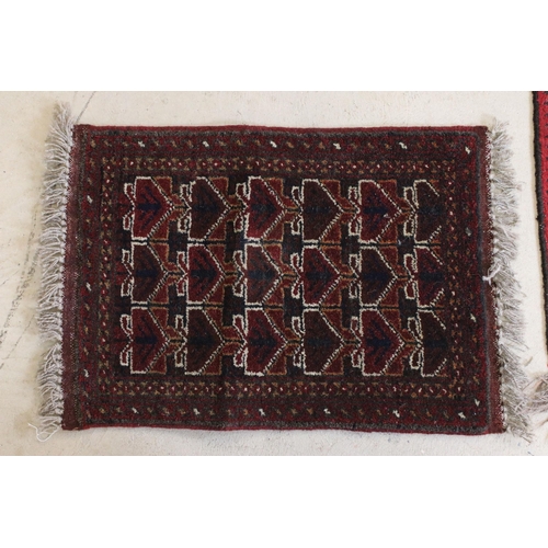 595 - Red ground prayer mat with geometric design, 74 x 60.5cm and two other prayer mats (3)