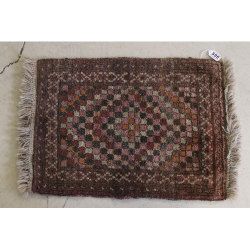 595 - Red ground prayer mat with geometric design, 74 x 60.5cm and two other prayer mats (3)