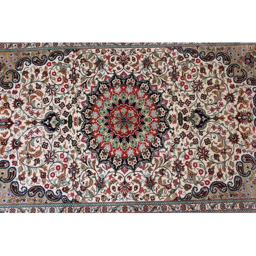 599 - 20th century Iranian silk red ground wall hanging, central medallion within borders, 161 x 99cm