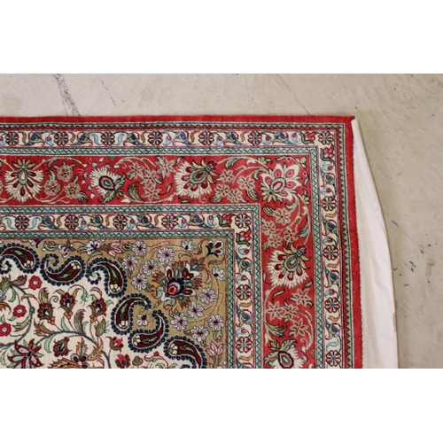 599 - 20th century Iranian silk red ground wall hanging, central medallion within borders, 161 x 99cm