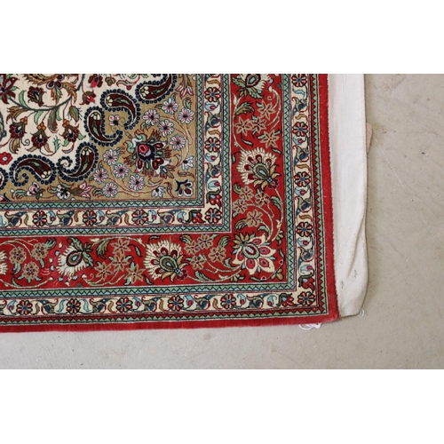 599 - 20th century Iranian silk red ground wall hanging, central medallion within borders, 161 x 99cm