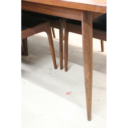 617 - Large mid century teak extendable dining table with tapering legs along with set of six chairs uphol... 