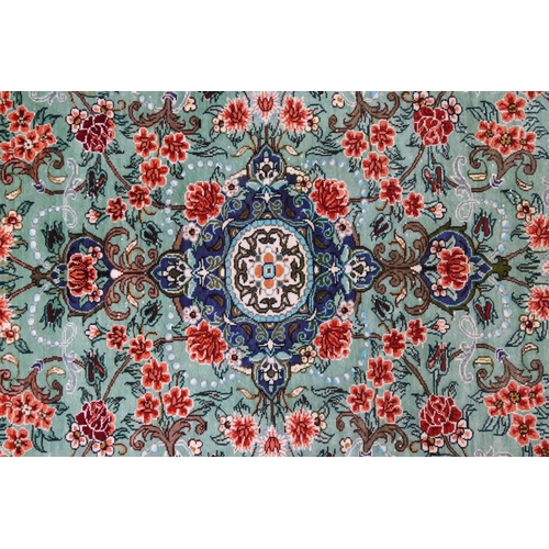 620 - 20th century Iranian silk turquoise ground prayer mat, central medallion within flowering scrolls an... 