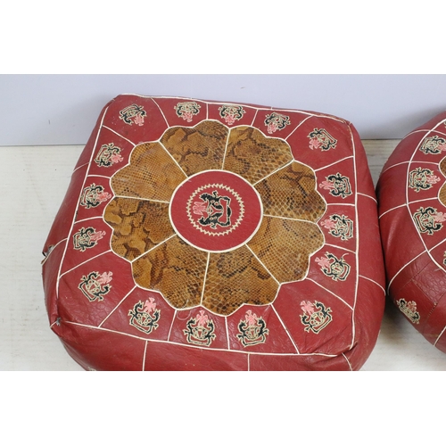 625 - Pair of leather and snakeskin patch pouffes footstools, in square and round form with coat of arms c... 