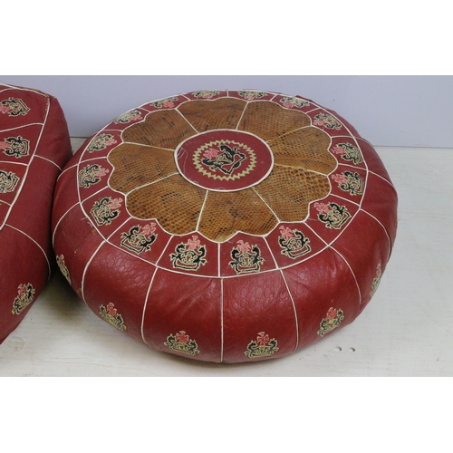 625 - Pair of leather and snakeskin patch pouffes footstools, in square and round form with coat of arms c... 